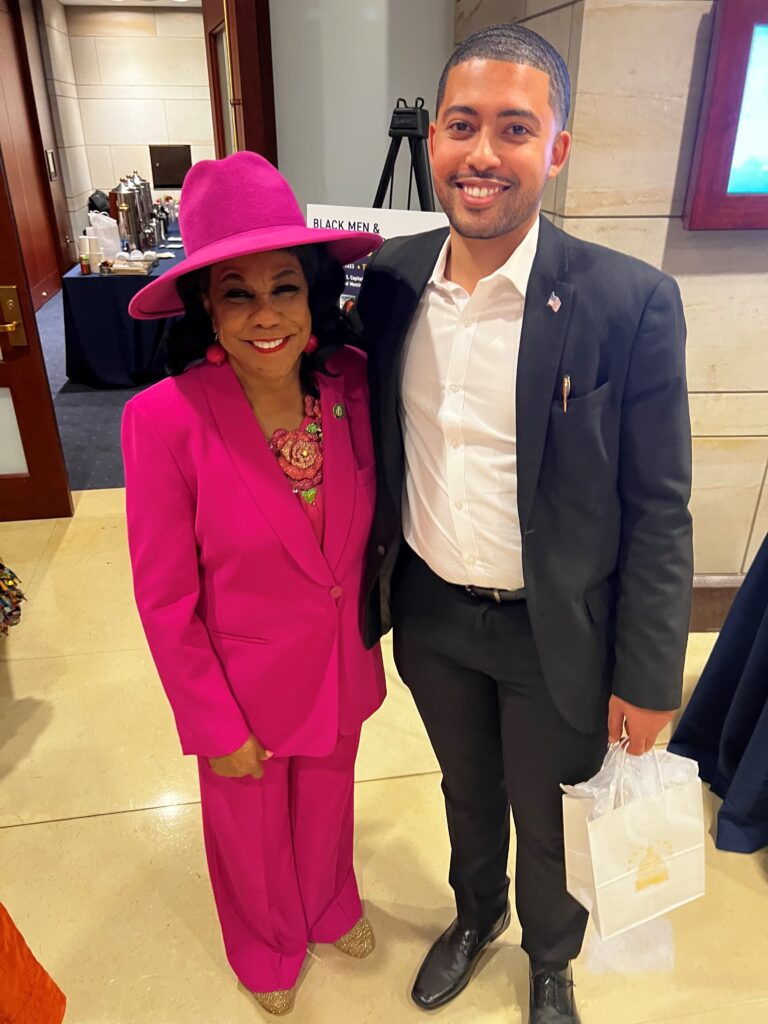 Congresswoman Frederica Wilson and Kylar Wiltz pose together in a Capitol Hill office