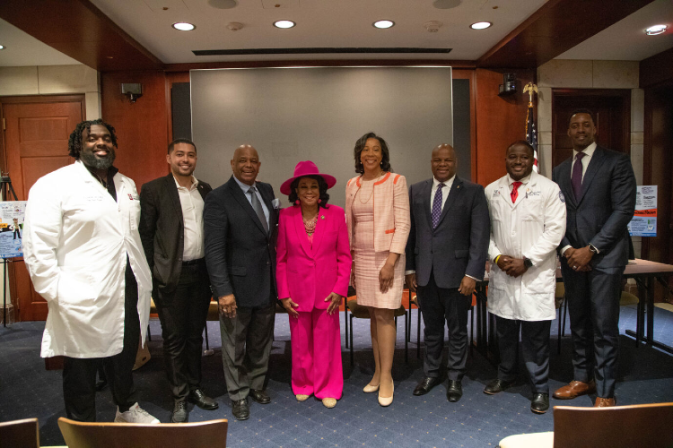 Panelists from a Congressional Briefing on Black Men and Boys in Medicine pose with ACE Awardee Rep. Frederica Wilson and Danielle Turnipseed, JD, MHSA, MPP, Chief Public Policy Officer at the AAMC.